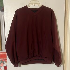 Forresters wine color v-neck pullover windbreaker. Front pockets. Fully lined.